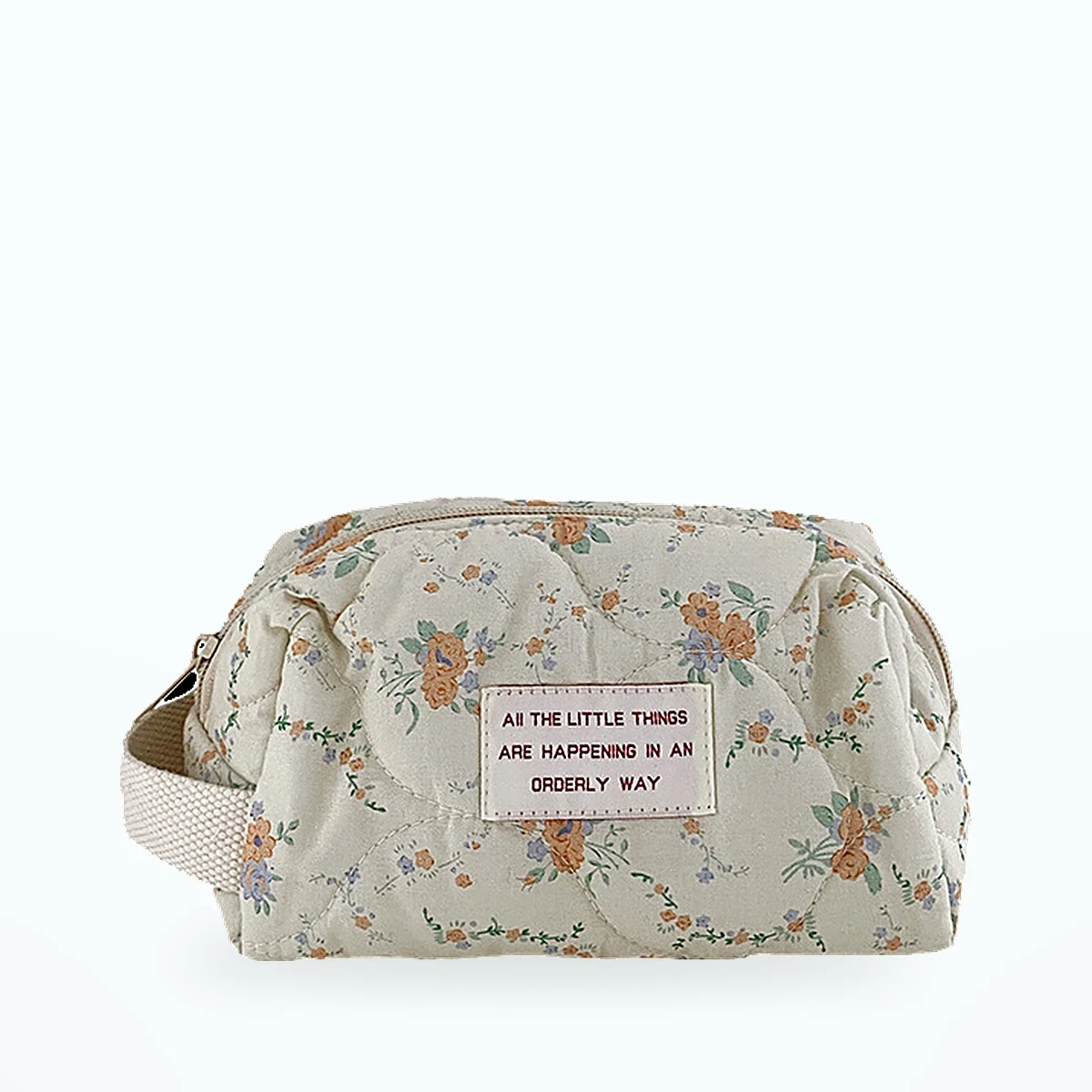 Petite trousse matelassée fleurie – Crème à fleurs